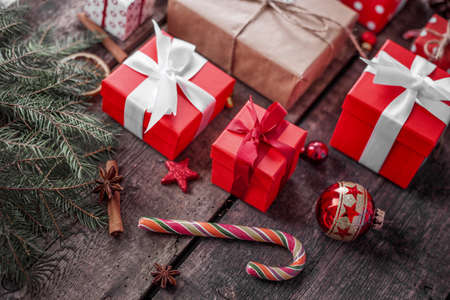 Gift box in wrapping paper with satin ribbon. Merry Christmas holiday concept.の写真素材
