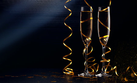 Glasses of champagne with splash, celebration theme conceptの写真素材