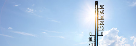 Mercury thermometer. Summer heat or global warming climate change concept.