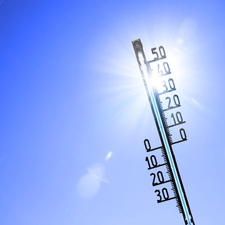 Mercury thermometer. Summer heat or global warming climate change concept.