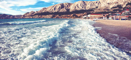 Feeling of freedom concept. Big waves beats against the pier.の写真素材