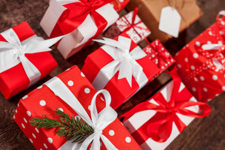 Gift box in wrapping paper with satin ribbon. Merry Christmas holiday concept.の写真素材