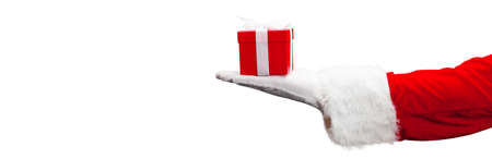 Santa holding a gift. Merry Christmas composition concept.の写真素材