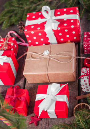 Gift box in wrapping paper with satin ribbon. Merry Christmas holiday concept.の写真素材