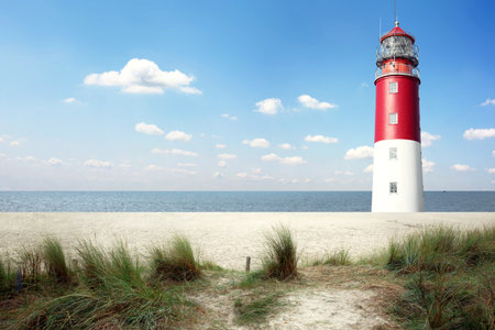 Beautiful summer seascape with lighthouse and skyの写真素材