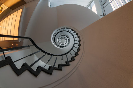 View up a dramatic double spiral staircase.