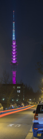 Hannover, Germany - March 18, 2015: Telecommunication tower Telemax in Hannover. The tower is illuminated in magenta, the corporate color of Deutsche Telekom, for the CeBit.のeditorial素材