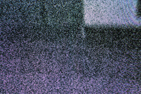 Television screen with static noise caused by bad signal receptionの写真素材