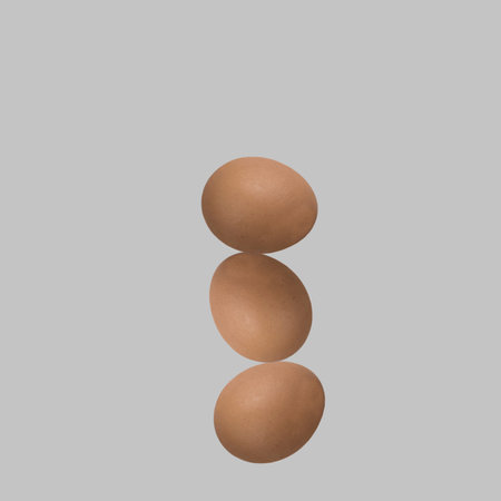 Eggs are isolated on a light background. Red eggs on gray background. Neatly arranged eggs.