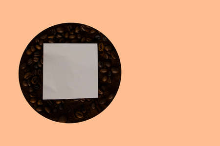 Coffee beans background. Top view collection of assortment of coffee beans and place for text, top view of circle sign isolated on yellow background.の写真素材