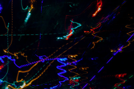 Photo effects, background, dark abstraction. Abstract colorful background, curves, Christmas glitter, fiery background. Dark gold, red and black, defocused.の写真素材