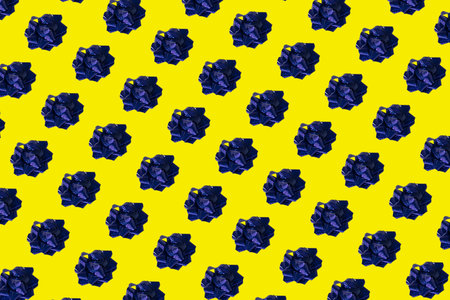 Set of gift blue bows with ribbon on a yellow background. Blue gift bow on a yellow background. High...