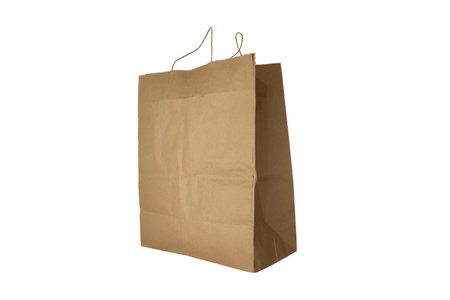 Paper bag on a white background. home delivery concept. Package with food on a light background.の写真素材