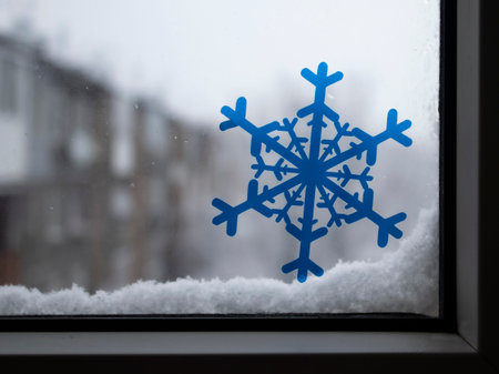 Christmas frosty snowflake pattern on the window glass.の写真素材