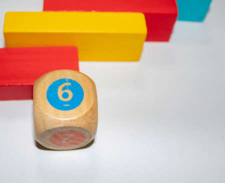 board games. Colored Wooden Figures from Ecological Materials for Board Games for Children. Collection of Cubes on the Light Table. Copy Space for Text. game background.の写真素材