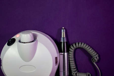 Master Uses Electric Cuticle Cleaner During Manicure In Salon. Hardware Fraser Closeup. Hand care concept.の写真素材