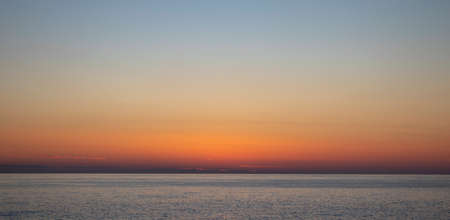 Landscape With Sea Beautiful Sunset on Beach. Beautiful Sunset Sunrise Over Blue Sea Ocean Red Sky.の写真素材