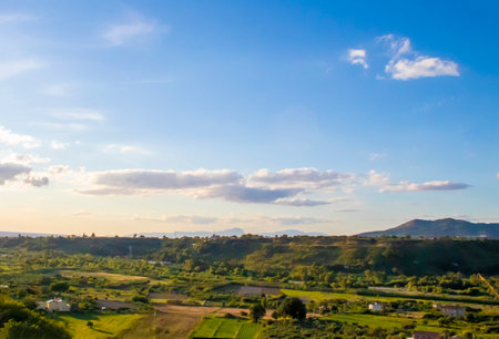 Beautiful Panoramic View of the Mountain Landscape in Italy. Villages at the Foot of the Mountain with Beautiful Terraces, Gardens and Views of the Surrounding Mountains Above.の写真素材