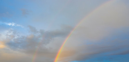 beautiful rainbow. sky and rainbow background.の写真素材