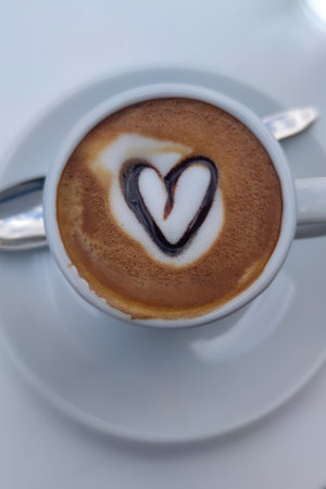 Cup of Coffee with Heart Shape. Hot Latte Coffee Put on Table in Cafe Restaurant, Drink Breakfast in...