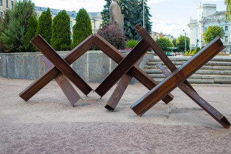 Nti-tank Hedgehogs on the Streets of the City. Readiness for Invasion, Roadblocks, Fences. War in Ukraine. Russian Aggression.の写真素材