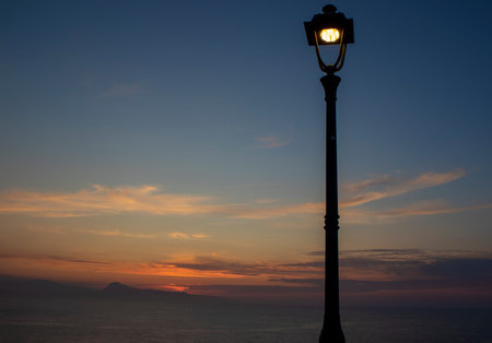 Lantern Streetlight and Beautiful Sunset. Lantern with Burning Light at Sunset.
