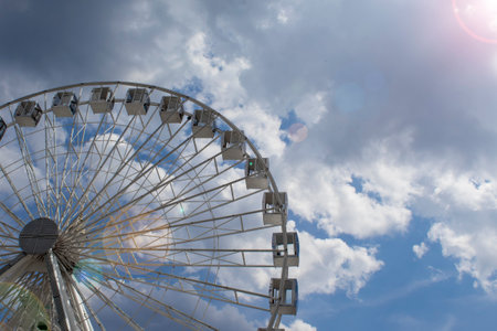 Ferris Wheel Against the Blue Sky. Modern Ferris Wheel.の写真素材