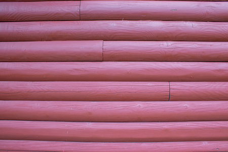 Wooden wall. Wooden wall from logs as a background texture.の写真素材