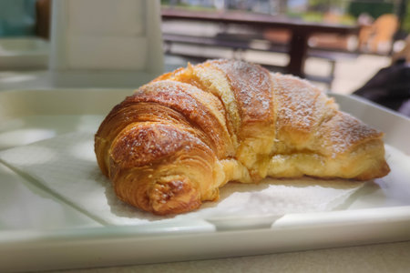 Croissants, count on in a cafe in Naples. Typical Italian Neapolitan sweets on a bakery window,...