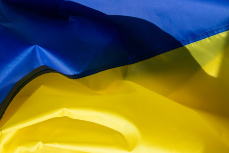 The flag of Ukraine is a banner of two equally sized horizontal bands of blue and yellow.の写真素材
