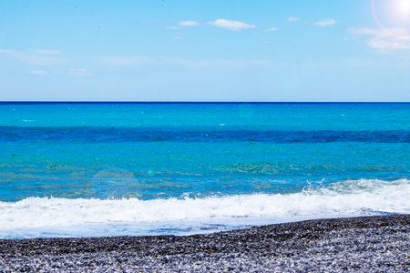 Shining Water. Calm sea or ocean surface with small waves and blue sky.の写真素材