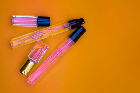 Bottles for fragrances. Bright Background. Women's perfume, fragrant oil with Place for your text.