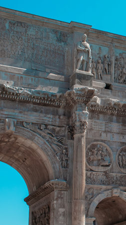 A grand ancient structure showcases elaborate sculptures and detailed reliefs, standing strong against a vibrant blue sky, capturing historical significance and artistic mastery.の写真素材