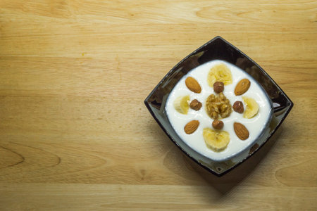 Healthy breakfast, yogurt bowl with dried fruits