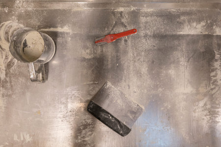 Metal table with bakery tools upon it