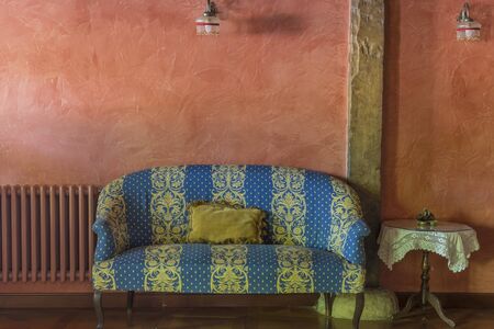 Blue striped sofa inside a roomの写真素材