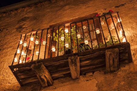 Balcony, illuminated only by candles. The night of candles in Pedraza, Segoviaの写真素材