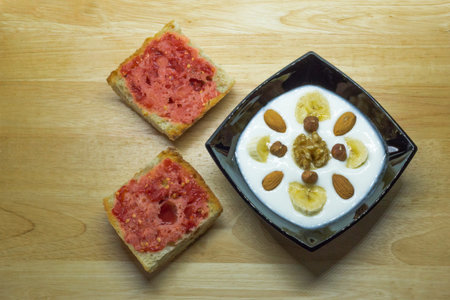 Healthy breakfast with yogurt and bread toasts, top view