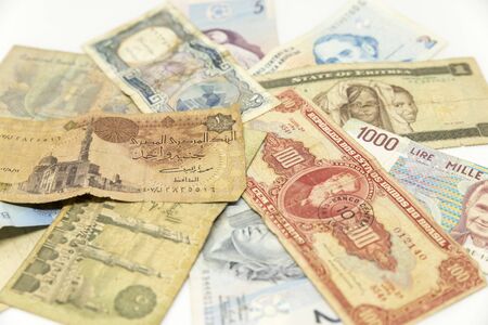 A bunch of bank notes from different countriesの写真素材