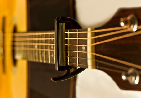 The capo on acustic guitar fingerboardの写真素材