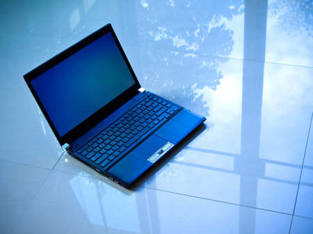 black laptop computer on the floor