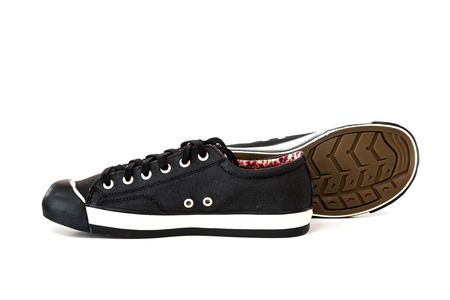 black canvas sneaker on white backgroundの写真素材