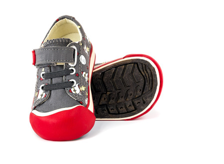 gray canvas sneaker for kids on white backgroundの写真素材