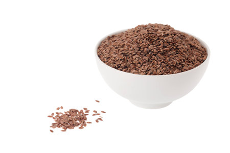 Brown Linseed or Flax seed isolated on white backgroundの写真素材