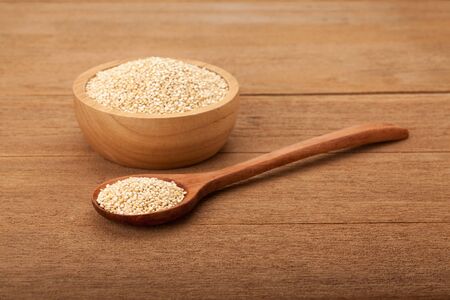 quinoa in wooden bowl on wood backgroundの写真素材