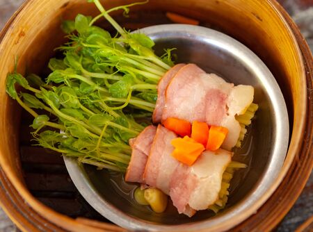 Bacon-wrapped peas sprouts rolls one of menu in dim sum restaurantの写真素材