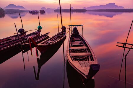 Landscape of beautiful and colorful sunrises and the limestone mountains in thailandの写真素材
