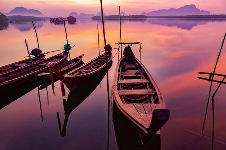 Landscape of beautiful and colorful sunrises and the limestone mountains in thailandの素材 [FY310143863206]