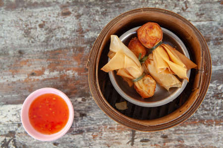 Top view of Thai Money Bag or Toong Tong is Thai Traditional Spring Rolls one of menu in Dim Sum Restaurantのeditorial素材