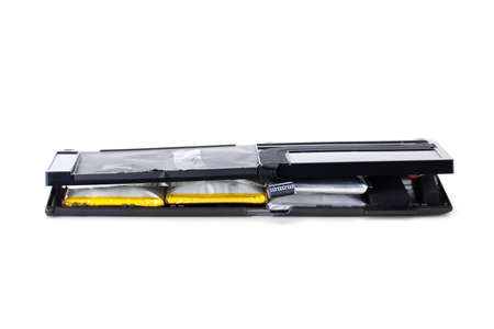 damaged swollen Lithium polymer, Li-ion batteries for laptop isolated on white background.の写真素材